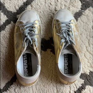 Golden Goose gold sneakers